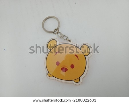 a keychain with a cute bear picture