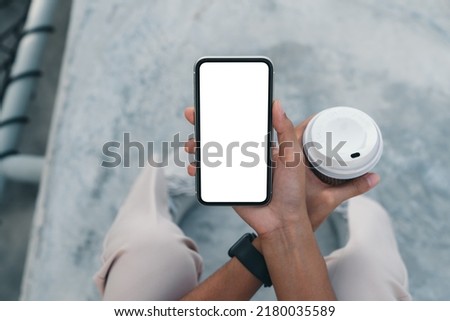 close-up phone on hand holding above view angle Royalty-Free Stock Photo #2180035589