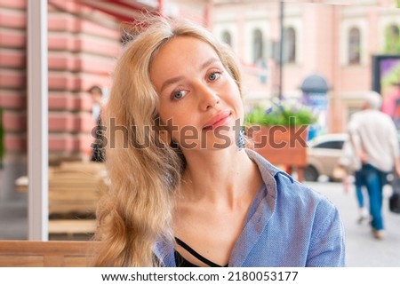 Student girl in street cafe portrait