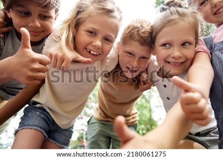 Close up of portrait of kids embracing together Royalty-Free Stock Photo #2180061275