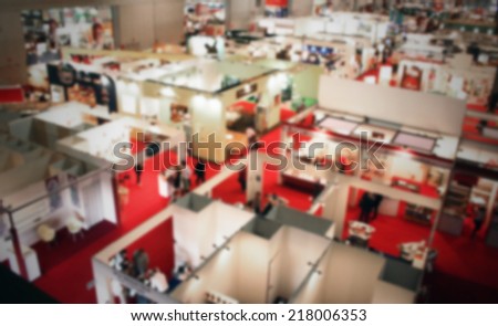 Trade show interior location view. Intentionally blurred background.