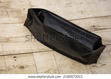 Black bag packing, system, center, medicine, technology, on a wooden floor