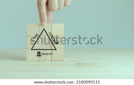 Project management triangle; Time, Quality, Cost concept. Valuable tool for prioritizing and decision making. Available time to deliver, available money or resources, fit to-purpose to be success. Royalty-Free Stock Photo #2180090115
