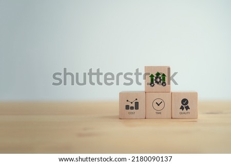 Project management triangle; Time, Quality, Cost concept. Valuable tool for prioritizing and decision making. Available time to deliver, available money or resources, fit to-purpose to be success. Royalty-Free Stock Photo #2180090137