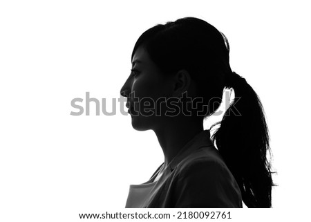 Silhouette of asian woman profile. Royalty-Free Stock Photo #2180092761