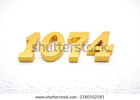       Number 1074 is made of gold painted teak, 1 cm thick, laid on a white painted aerated brick floor, visualized in 3D.                            