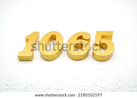      Number 1065 is made of gold painted teak, 1 cm thick, laid on a white painted aerated brick floor, visualized in 3D.                                
