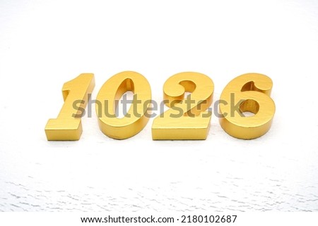   Number 1026 is made of gold painted teak, 1 cm thick, laid on a white painted aerated brick floor, visualized in 3D.                               