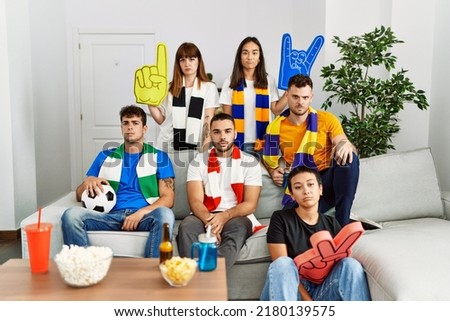 Group of people looking soccer in tv, friendship