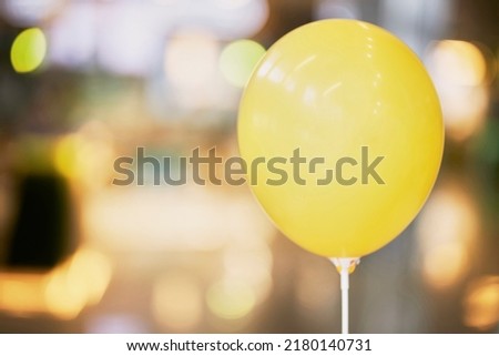 Yellow ball close-up. Balloon on a blurred background 
