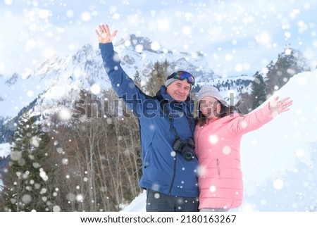 couple elderly man and woman, mountain hikers admiring mountain winter landscape, Sports Concept, Healthy Lifestyle, Winter Activity, beautiful winter natural landscape, walks in winter white forest