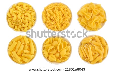 Raw italian pasta in ceramic bowl isolated on white background. Top view. Flat lay. Set or collection Royalty-Free Stock Photo #2180168043