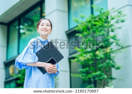Outdoor portrait of a business woman Royalty-Free Stock Photo #2180170887