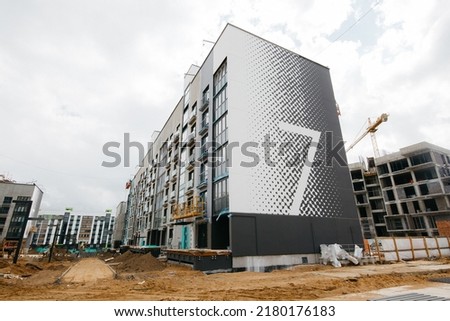 construction of modern stylish apartment buildings in Scandinavian style. High quality photo