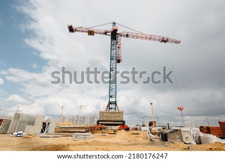 Construction site with high cranes. Construction of modern apartment buildings . High quality photo
