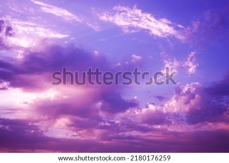   Beautiful purple pink evening sky with clouds view. Colorful sunset background with space for design. Romantic.                             