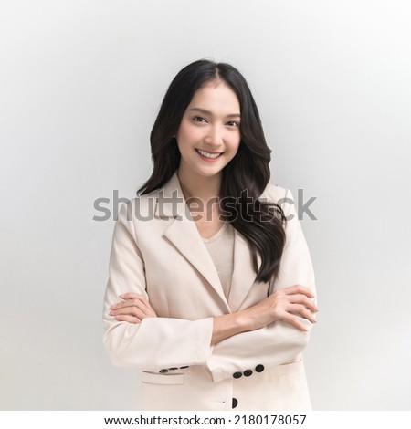 Studio portrait photo of young beautiful Asian woman in formal suit dressing with confident and luxury looking and attractive on white background studio shot. Royalty-Free Stock Photo #2180178057