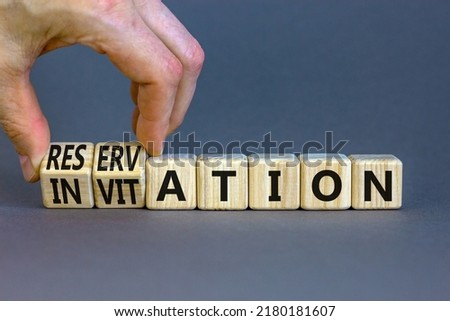 Invitation or reservation symbol. Businessman turns cubes and changes the concept word Invitation to Reservation. Beautiful grey background. Business Invitation or reservation concept. Copy space.