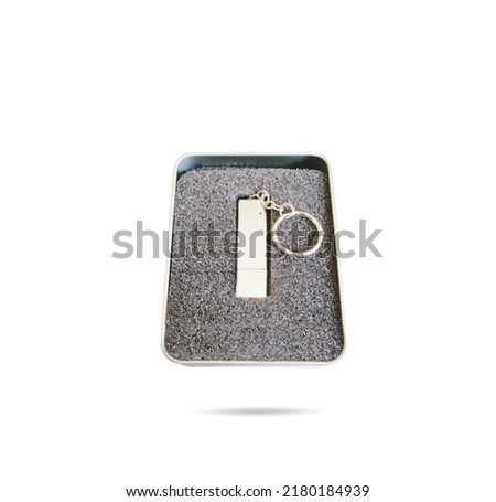 USB memory stick as a present in a gray sponge box. Usb flash drive in a silver metal box with sponge nest. Royalty-Free Stock Photo #2180184939