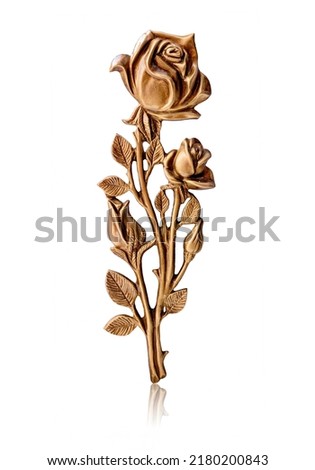 Bronze rose. Shiny metallic rose flower isolated on white background. Yellow metal decorative item.