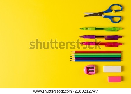 Image of school drawing tools on yellow surface with copy space. School equipment, tools, learning and education concept.