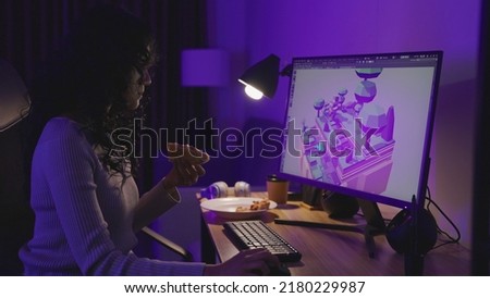 Asian Female Freelancer Working with Inspiration in her Studio. Concentrated Woman Creating her Own Project, She makes games designed by 3D animation software.