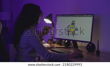 Asian Female Freelancer Working with Inspiration in her Studio. Concentrated Woman Creating her Own Project, She makes Games Designed by 3D Animation Software.