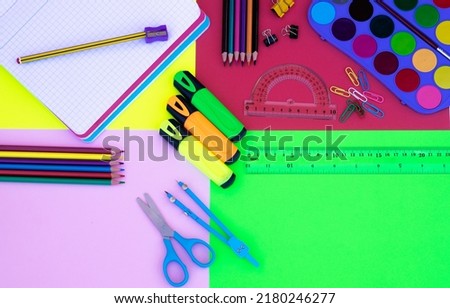 Back to school concept. Group of school office supplies on colorful background, pencils, notebooks, scissors, elements, copy space