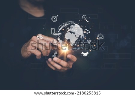 Businessman using smart phone . Global business internet connection application technology and digital marketing. Finance and Banking Digital Link Technology Big Data Royalty-Free Stock Photo #2180253815