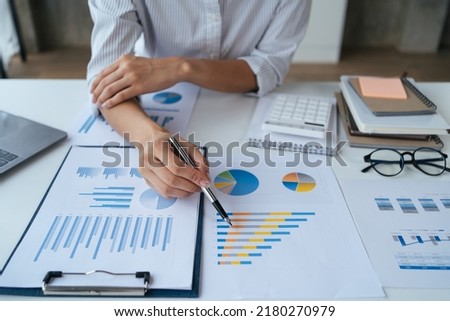 Businessman analysis marketing plan, Accountant calculate financial report, computer with graph chart. Business, Finance and Accounting concepts.