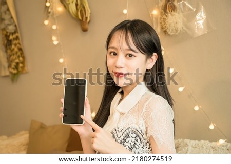Nightwork woman operating a smartphone