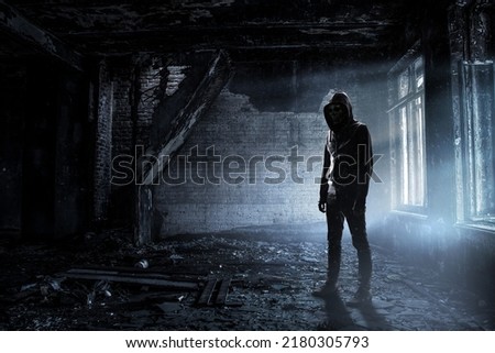 Silhouette of man in hoody Royalty-Free Stock Photo #2180305793