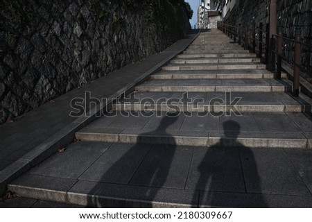 I can see the shadows of the two brothers on the stairs