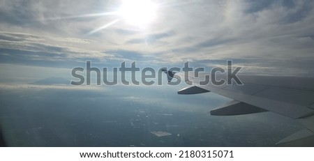 dont be so close to the sun, icarus  Royalty-Free Stock Photo #2180315071
