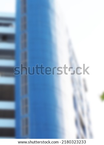 Building windows blue white light blur as background