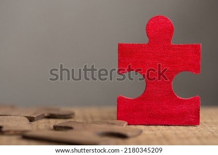 Creative idea and solve the problem concept. Teamwork success strategy - wooden puzzle close up Royalty-Free Stock Photo #2180345209