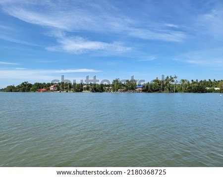 River view landscape at Amphawa District, Samut Songkhram, Thailand Royalty-Free Stock Photo #2180368725