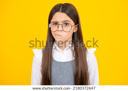 Angry teenager girl, upset and unhappy negative emotion. Emotional adorable little girl surprised and shocked, showing true astonished reaction on unexpected news. Funny teenager child girl face.