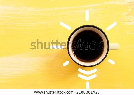 Coffee cup and lightbulb concept. Inspiration and innovation metaphor