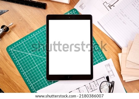 Overhead Shot Of Desk In Architects Office With Plans Drawing Instruments And Digital Tablet