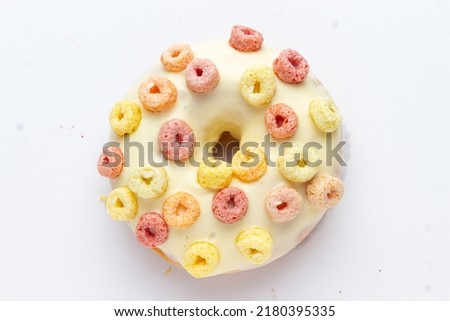Doughnuts with colorful sprinkles isolated on white background top view