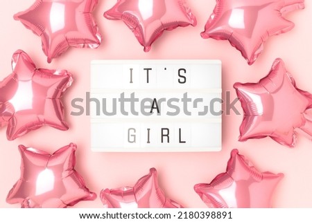 Its a girl - quote. Frame made of pink star foil balloons and lightbox.