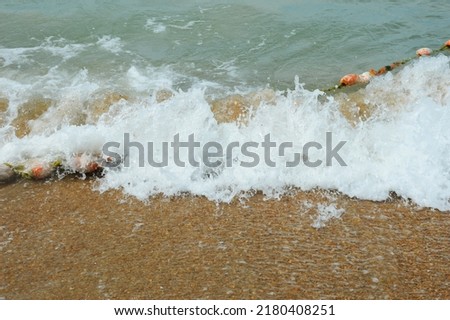 sea waves. turquoise water. summer sea with a sandy shore. warm summer, sun, rest. background for the design.