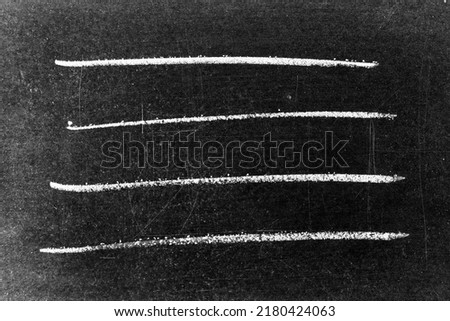 White color chalk as line shape on blackboard background for decoration or grunge layer
