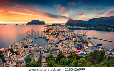 Picturesque summer view from flying drone of Alesund port. Great sunset in west coast of Norway, at the entrance to the Geirangerfjord. Traveling concept background.