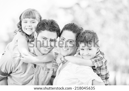 Cute family portrait of 4 people