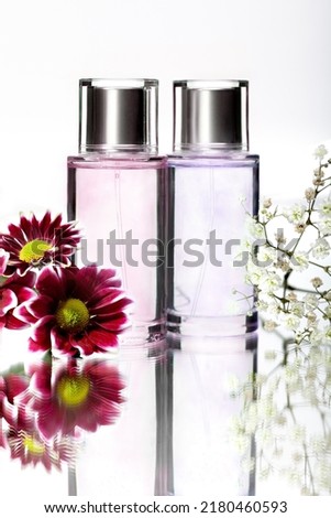 Women's bottles of perfumes with flowers