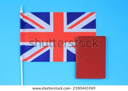 Passports and flag of Great Britain on yellow background. Immigration, refugee, change of citizenship, refuge, residence, brexit European Union concept. Travel, recieving visa and tourism idea