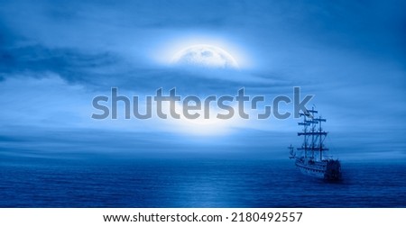 Sailing old ship in calm sea - Night sky with moon in the clouds "Elements of this image furnished by NASA Royalty-Free Stock Photo #2180492557