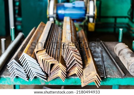 Blanks of metal corners at the factory for further processing. metal profile. Warehousing and storage of prepared elements for metalworking in a factory shop